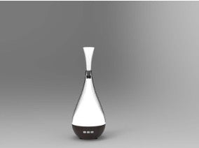 Black and white vase-shaped diffuser on a gray background