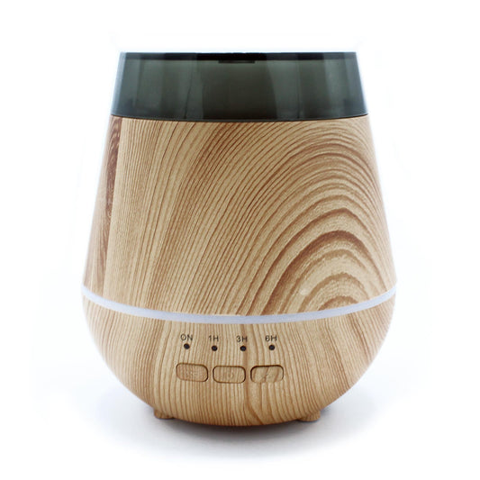 Wooden-textured diffuser with black top and white base on a white background