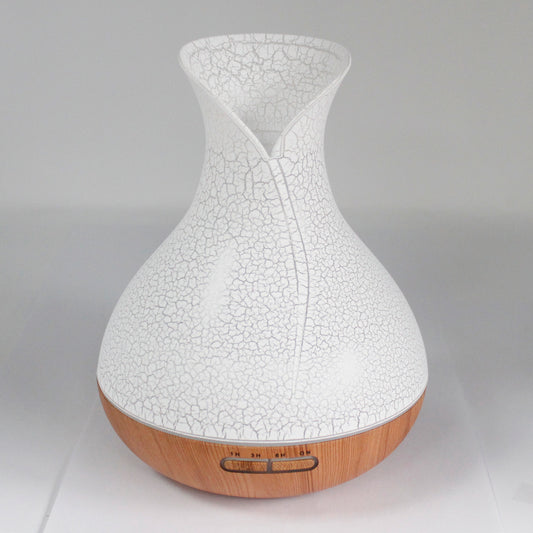 vase-shaped white with shell pattern; wood patterned at the bottom diffuser